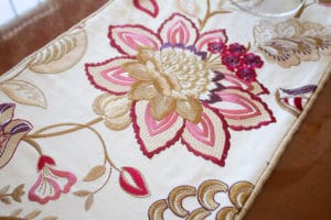 Magenta and purple pattern table runner in dining room redesign
